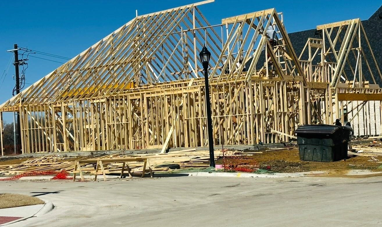 Interior of a home under construction showing wood stud framing